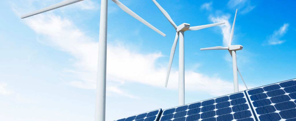 Des éoliennes et des panneaux solaires sont représentés sous un ciel bleu, représentant des sources d'énergie verte et d'énergie renouvelable.